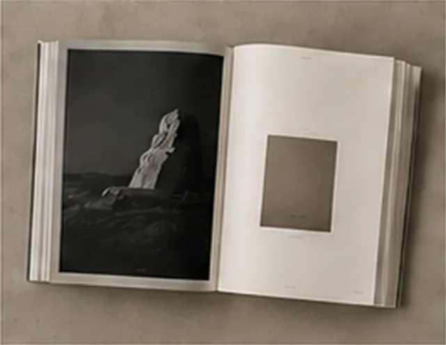 Lumen Press, an open photobook spread on plaster