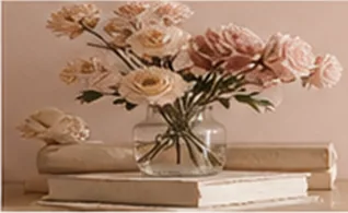 Roses in a glass vase on a stack of books