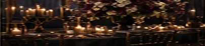 A bar dressed with candles and white blooms