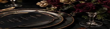 A black charger plate with an engraved menu card and rose sprigs